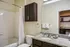 ReNew Federal Hill East Bathroom with Granite Countertops and Brown Cabinetry