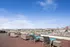 Expansive rooftop terrace offering stunning city skyline views, complete with stylish lounge furniture and a serene atmosphere.