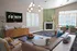 Chic living room with modern decor, featuring a cozy fireplace, stylish sofa, and elegant lighting, perfect for relaxation and entertainment.