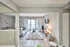 Bright and modern living room with stylish decor, featuring a comfy sofa, sleek coffee table, and large sliding glass doors opening to a scenic view.
