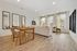 Bright open-concept living and dining area with elegant furnishings and abundant natural light.