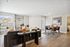 Chic open-plan living and dining area with modern decor, inviting natural light, and stylish seating arrangements.