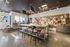 Vibrant creative studio with sleek work tables, colorful wall art, and modern lighting, perfect for inspiring artistic expression.