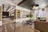 Luxurious modern living room with sleek fireplace, cozy seating, and elegant lighting creating a warm ambiance.