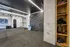 Modern multifunctional home gym featuring a climbing wall, punching bag, and organized training equipment for a dynamic workout experience.