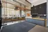 Sophisticated apartment lobby with modern architectural design, featuring elegant seating and stylish lighting.