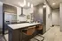 Modern kitchen featuring sleek cabinetry, stainless steel appliances, and elegant pendant lighting, perfect for gourmet cooking and entertaining.