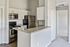 Modern kitchen with sleek stainless steel appliances, elegant granite countertops, and ample cabinet space, perfect for culinary enthusiasts.