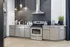 Townhomes at TSC Modern kitchen with sleek stainless steel appliances, elegant pendant lighting, and a stylish hexagonal backsplash, perfect for culinary enthusiasts.
