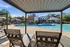 Townhomes at TSC Luxurious poolside view featuring modern architecture, inviting sun loungers, and a pristine blue swimming pool under a clear sky.