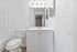 Townhomes at TSC Elegant bathroom with modern vanity, stylish lighting, and pristine white finishes creating a bright and welcoming space.