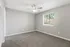 Townhomes at TSC Bright and inviting bedroom with plush carpet, neutral walls, modern ceiling fan, and ample natural light.