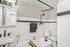 Charming bathroom with classic white subway tiles, vintage fixtures, and a cozy bathtub perfect for relaxation.
