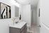 Chic bathroom with modern fixtures, elegant vanity, and contemporary wall art, offering a serene and stylish space.