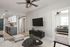 Inviting modern apartment with sleek kitchen, cozy living area, and stylish bedroom displaying contemporary design.