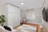 Bright and modern living space featuring sleek furnishings, cozy seating, and abundant natural light.