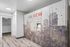 Contemporary apartment interior featuring sleek parcel locker system with artistic cityscape design.