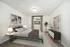 Chic bedroom with modern decor, cozy bed, stylish bedside lamps, and large window providing natural light.