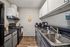 Modern kitchen with sleek countertops, stylish cabinets, and contemporary appliances for a chic culinary experience.
