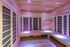 Elegant home sauna with contemporary wood paneling and ambient lighting for a relaxing space.