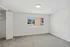 Bright, carpeted bedroom with a large window offering a scenic view, perfect for relaxing and unwinding.