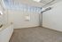 Bright and airy empty room featuring modern skylights, sleek ductwork, and plush carpeting, ideal for creative living space.