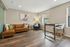 Contemporary living room with plush leather sofa, modern accents, and natural light creating a cozy retreat.