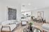 Modern open-concept living space featuring a stylish dining area, sleek kitchen, and elegant seating with contemporary decor.