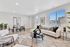 Bright and modern living room and dining area featuring stylish decor, sleek furniture, large windows, and inviting natural light.