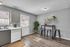 Modern kitchen with sleek countertops, a cozy bar seating area, and stylish decor accents, perfect for entertaining.