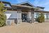 Modern clubhouse exterior with sleek architectural design and inviting entrance.
