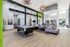 Modern recreation room with sleek pool table, stylish seating area, and contemporary lighting, perfect for entertainment and relaxation.