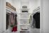Spacious and elegant walk-in closet featuring neatly organized clothes, stylish baskets, and ample shelving for a clutter-free living.