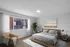 Chic bedroom with modern decor, featuring a cozy bed, stylish armchair, and large window with abundant natural light.