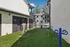 Charming apartment community featuring a cozy outdoor area with play equipment and seating, perfect for relaxation and play.