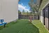 Inviting pet-friendly outdoor area with agility equipment on lush green artificial turf, perfect for playful activities.