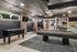 Modern game room featuring a sleek pool table, foosball table, stylish seating, and ambient lighting for entertainment.