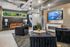 Modern lounge area featuring elegant seating, a chic leather sofa, and a sleek wall-mounted TV, perfect for relaxation and entertaining.