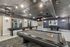 Chic recreation room featuring a pool table, shuffleboard, contemporary decor, and a stylish meeting area with plush seating.