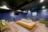 Cozy lounge with modern furnishings, plush seating, and ambient lighting, perfect for relaxation and social gatherings.