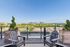 Stunning rooftop patio with scenic city views and comfortable seating, perfect for relaxation and entertainment.