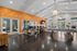 Modern co-working space in Edwardsville with stylish decor, a communal workspace, and bright natural light.