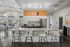 Modern kitchen with sleek granite countertops, stylish bar stools, and elegant lighting, perfect for entertaining in a bright, open-concept space.