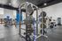 Modern fitness center featuring state-of-the-art exercise equipment, free weights, and cardio machines under sleek high ceilings.