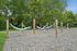 Relaxing outdoor hammock area with multiple hammocks under lush green trees, perfect for unwinding in nature.