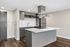 Modern kitchen design with sleek gray cabinetry, stainless steel appliances, and a spacious island for culinary creativity.