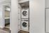 Modern apartment with conveniently located in-unit laundry and stylish bathroom featuring sleek fixtures.