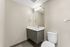 Contemporary bathroom with sleek fixtures, floating vanity, and elegant lighting.