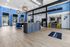 Modern clubhouse interior with vibrant blue accents, stylish lighting, and welcoming seating area at luxury apartments.