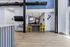 Modern and welcoming office interior featuring sleek design, vibrant yellow chairs, and an open layout with stylish decor accents.